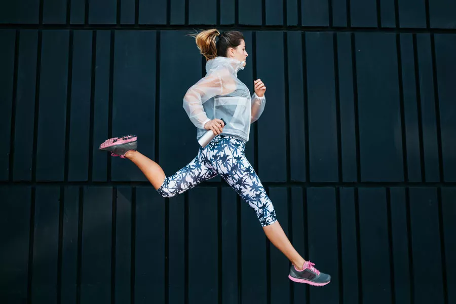sporty-woman-running-urban-environment